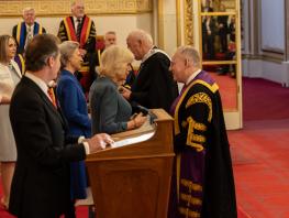 Her Majesty The Queen presenting Principal Paul Little, CBE with the Queen's Anniversary Award for research 