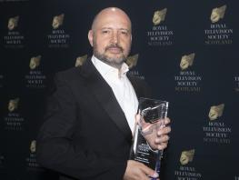 Marco Federico holding his Royal Television Society Award 