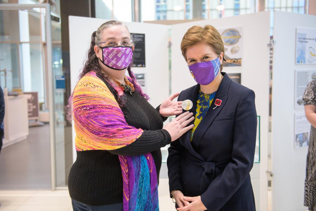 Jewellery student, Aileen Dickie Adams, presenting Scotland’s First Minister with a brooch to wear at COP26