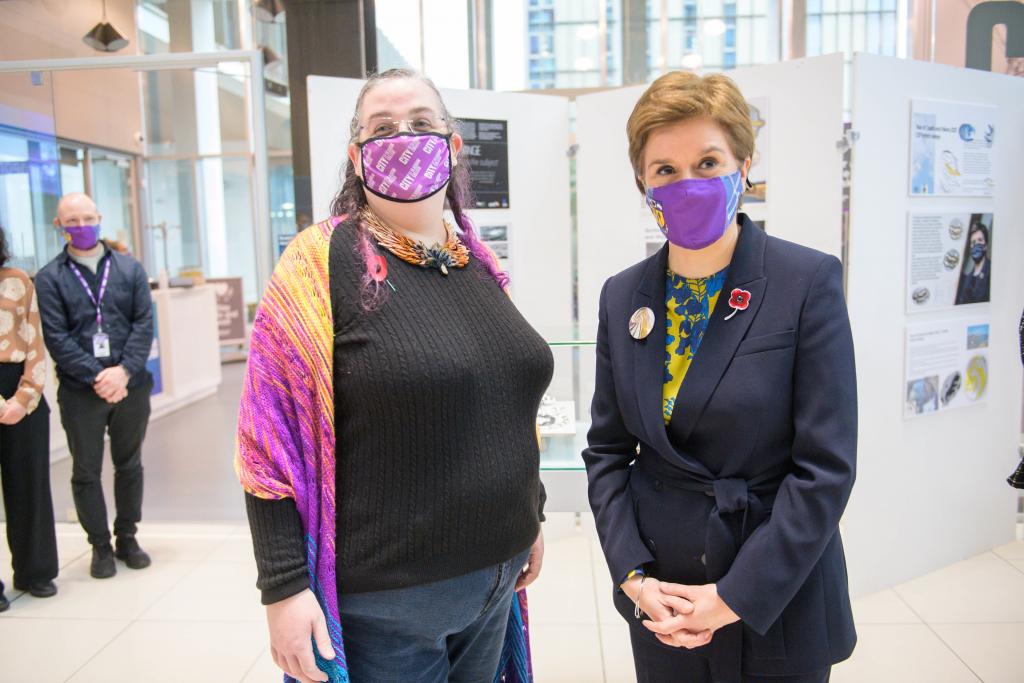 Photo of Jewellery student Aileen Dickie-Adams with First Minister after presenting her with her COP26 Climate Brooc