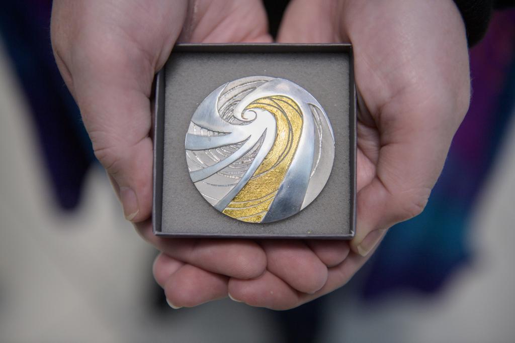 Photograph of Aileen Dickie-Adams winning climate inspired brooch