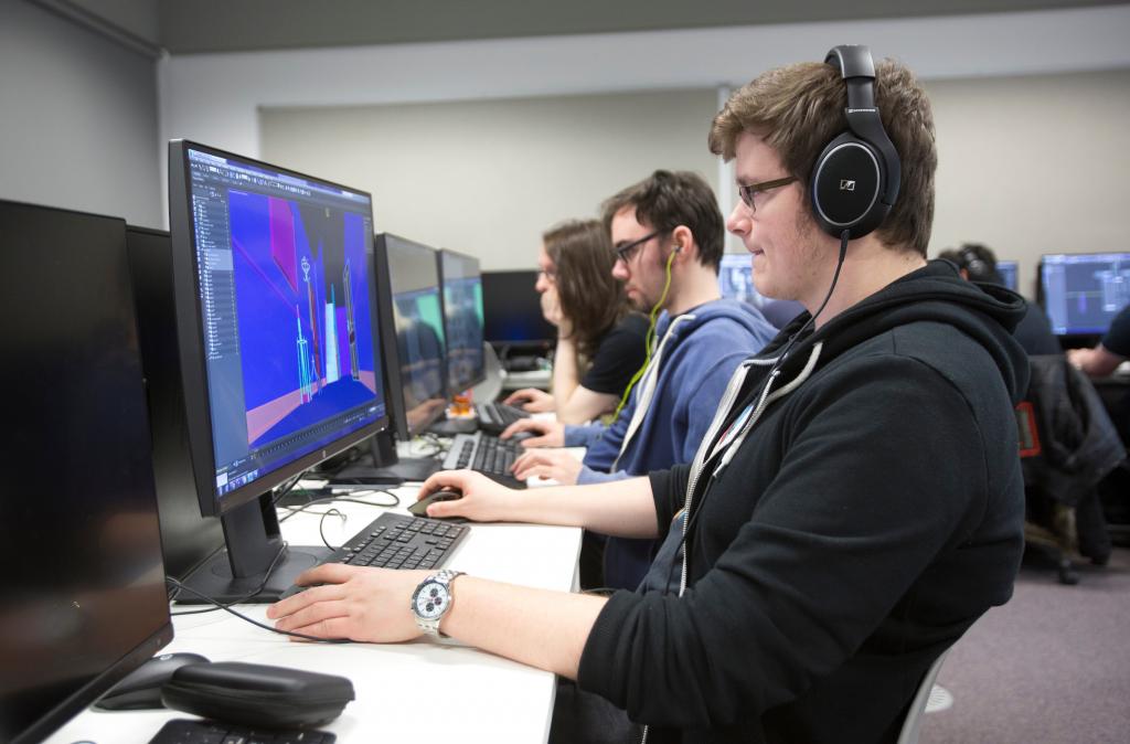 Cyber Security students using computers in IT labs