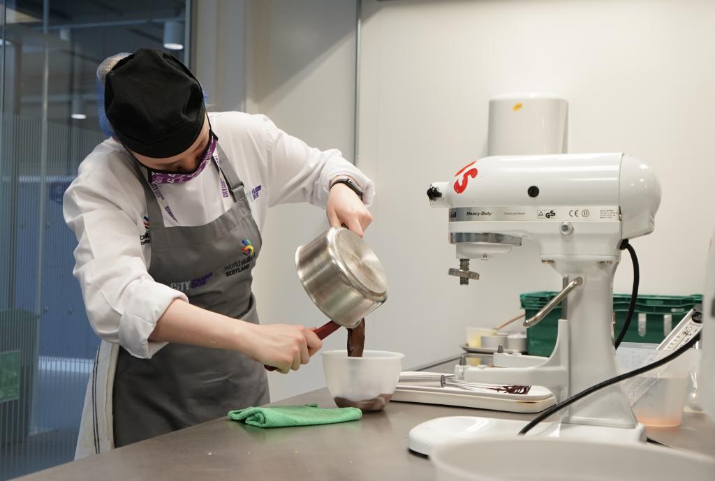 Jessica McKechnie working chocolate in WorldSkills National Finals Confectionery and Patisserie