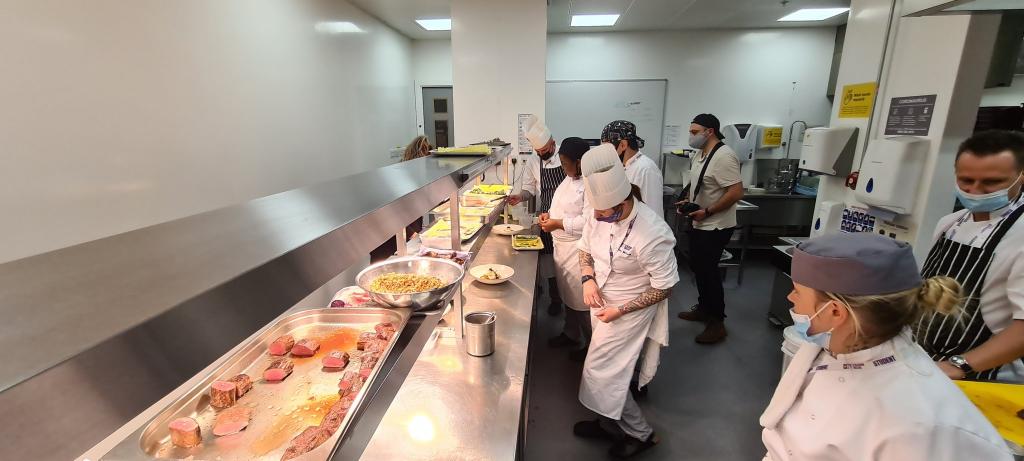 Professional Cookery students working in the kitchen at Scholars restaurant.