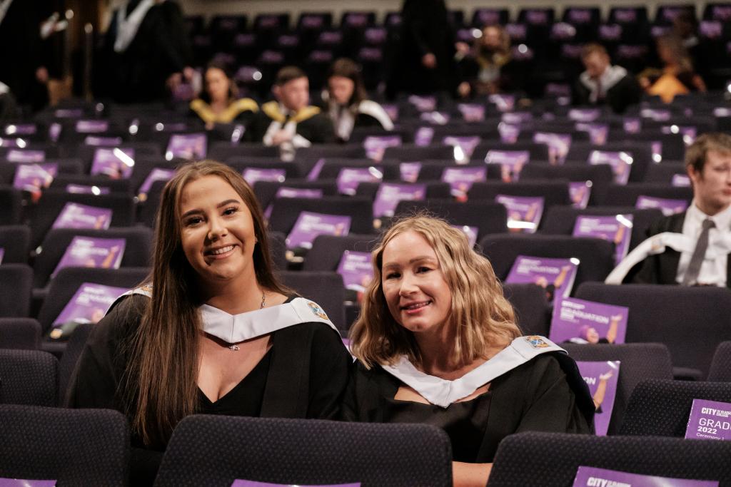 Graduates sitting in seats in the Royal Concert Hall waiting for graduation ceremony to start.