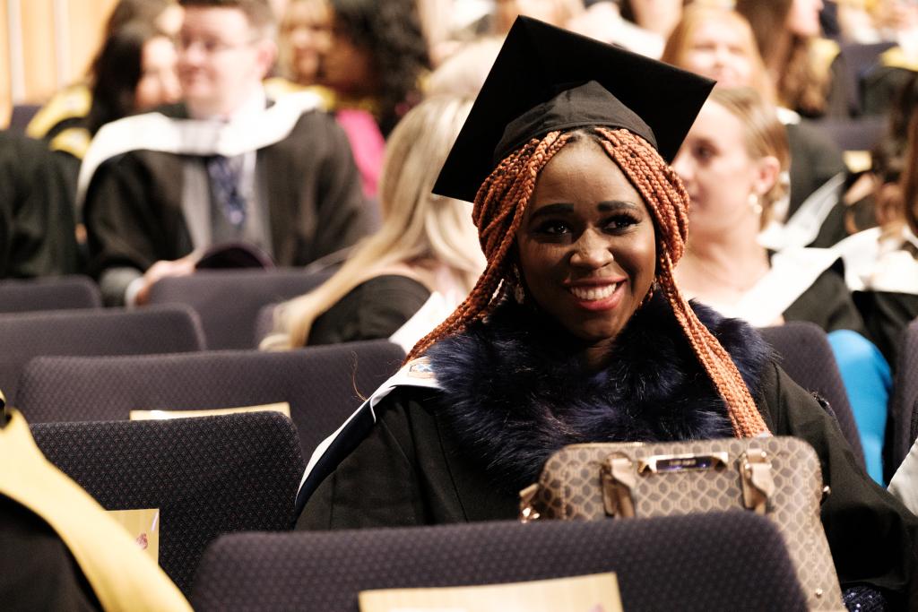 Students sitting waiting for graduation to start.
