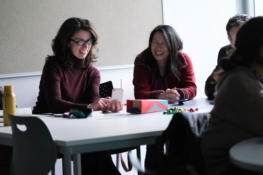 Staff sitting at a desk taking part in one of the elective sessions