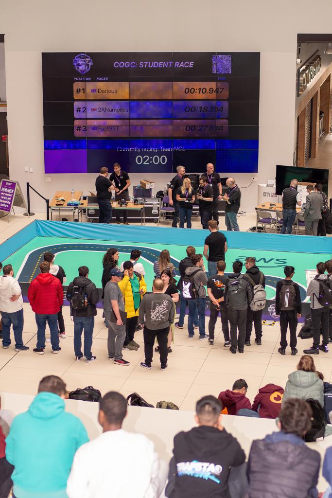 AWS Deepracer track on campus with students watching competition