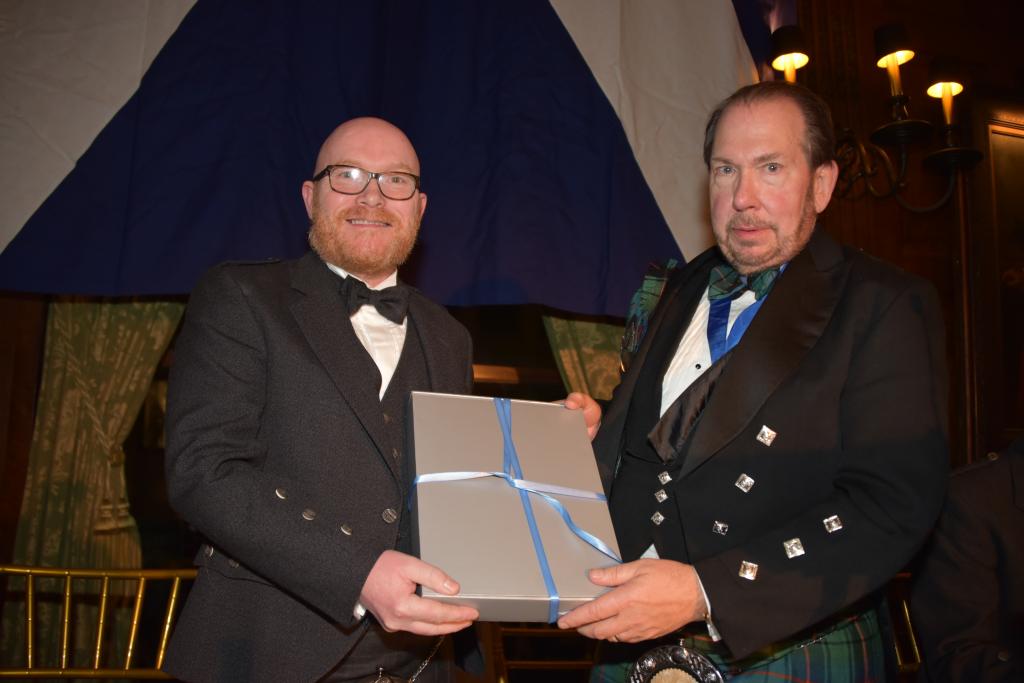 Gary Maclean receiving Mark Twain Award book (image courtesy of Nuala Purcell)