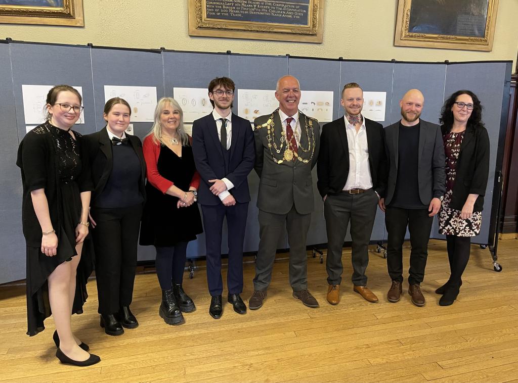 City students pose with lecturers and 9ct gold links for the Hammermen's Chain of Office.