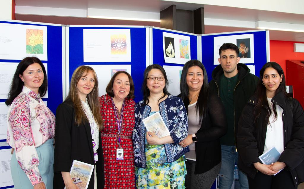ESOL students pose with their teacher