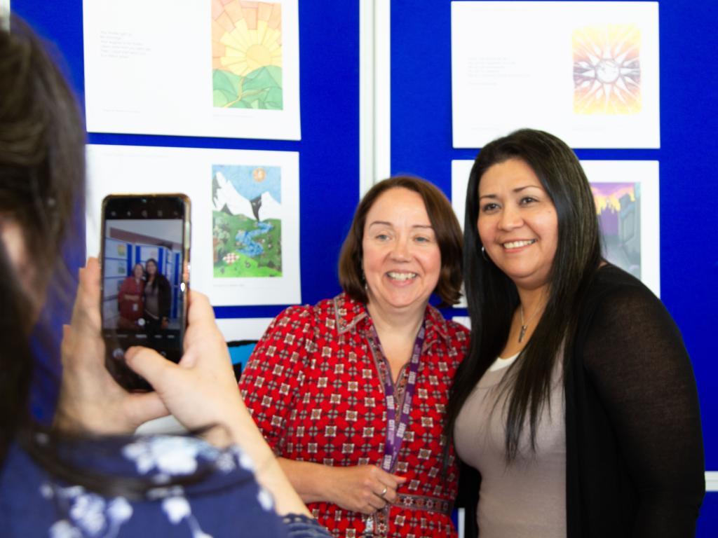 Rosie Quin the teacher poses with her student
