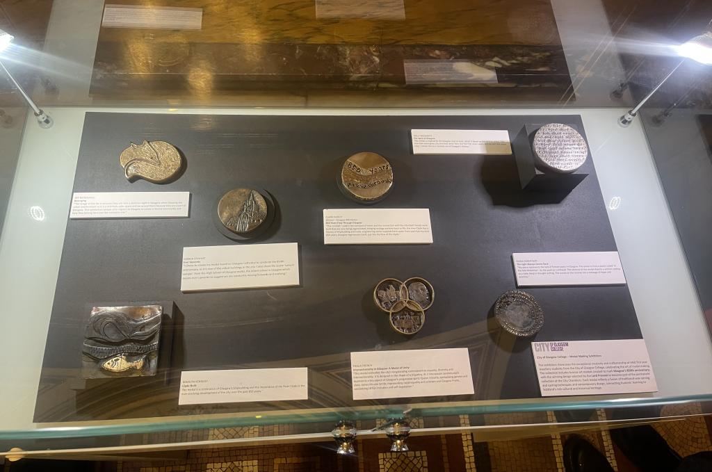 A glass display case with the winning medal.