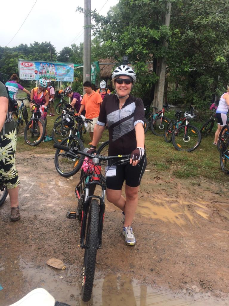 Kerry Bamber with her bike during cycle challenge in Cambodia