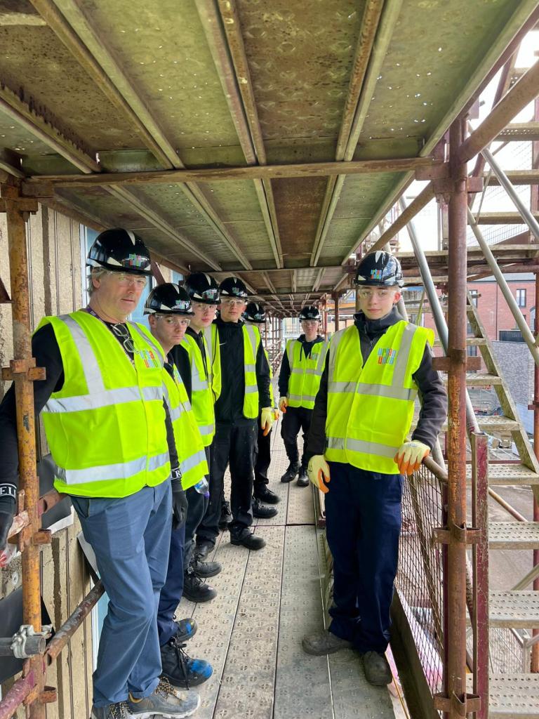 The site manager shows students different parts of the site.