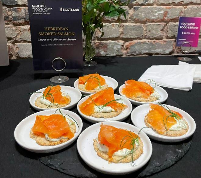 A table with plates of Hebridean Smoked Salmon at the Scottish Food and Drink Showcase.