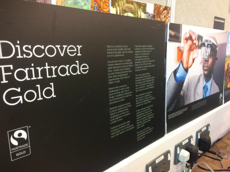 An exhibition stand with large white text "Discover Fairtrade Gold"