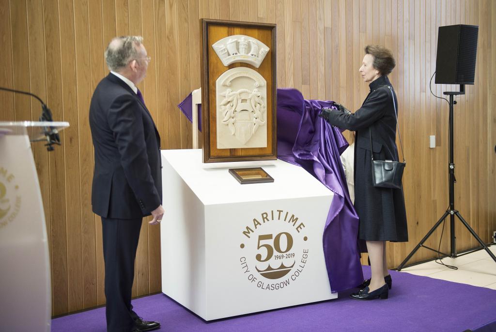 The principal and The Princess Royal unveil a commemorative stone bas-relief.