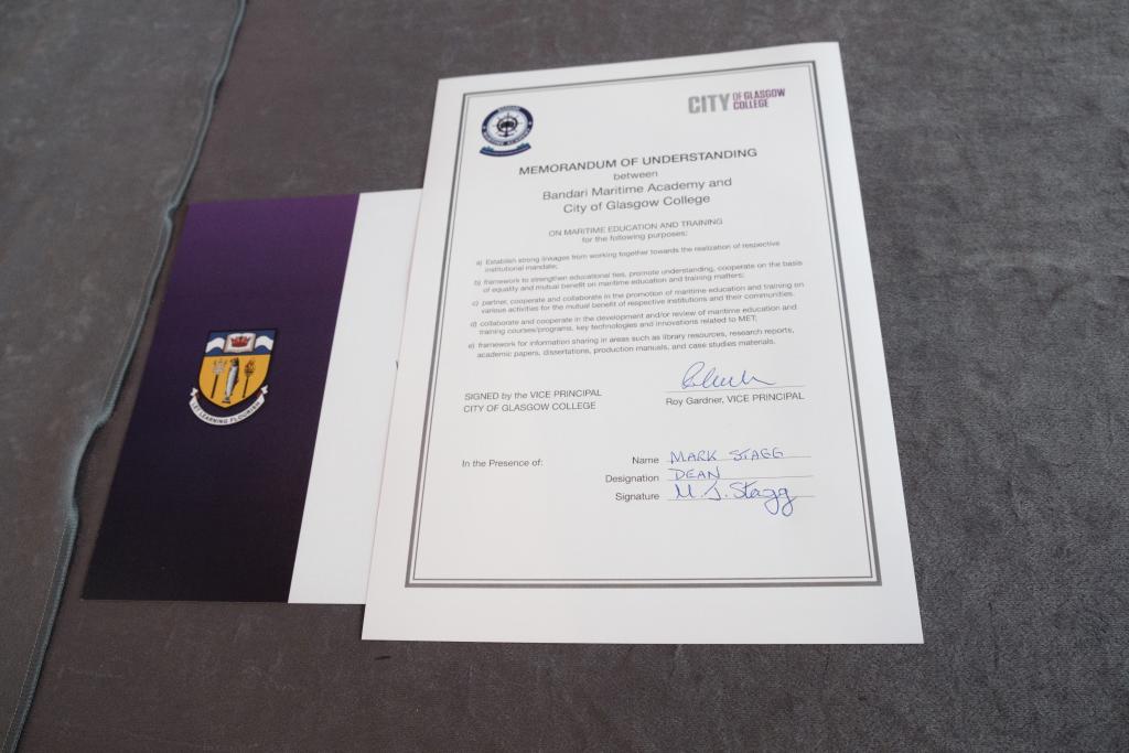 A close up of the memorandum of understanding between City of Glasgow College and Bandari Maritime Academy.