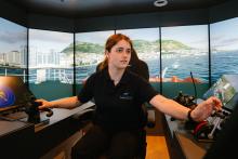 A nautical student using the nautical simulators at Riverside campus