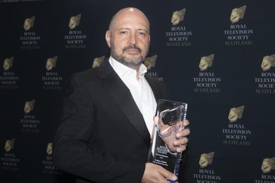 Marco Federico holding his Royal Television Society Award