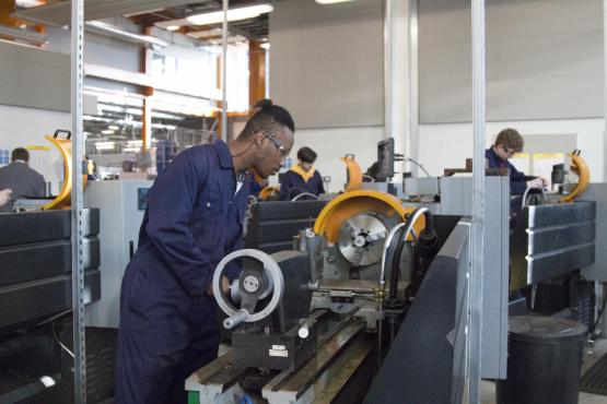 Students working on machinery in our Engineering workshops