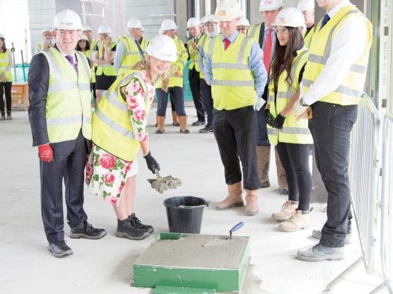 Construction milestone for City of Glasgow College ‘supercampus’ Senior civil servant Aileen McKechnie, the Scottish Government's director of advanced learning adding the final shovels of concrete to our Campus foundations