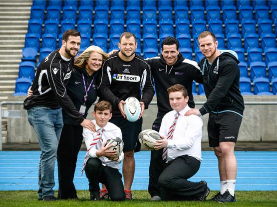 Warriors Convert Partnership with Newlands Junior College Glasgow Warriors pictured with Newlands Junior College pupils