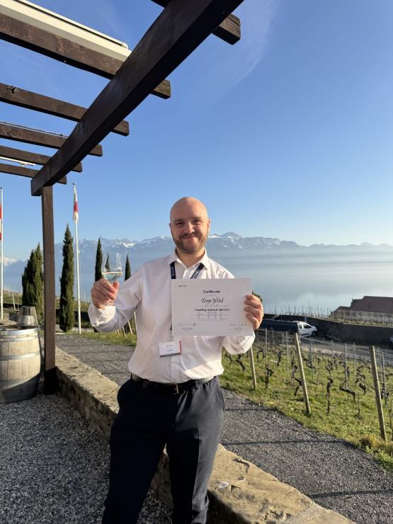 Tom with his certificate