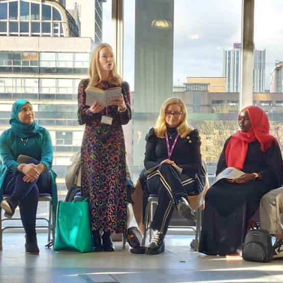 Poet Donna Ashworth performs her poetry for the workshop