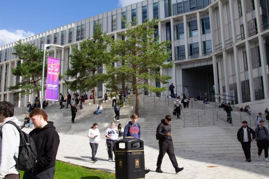 Students walking around outside City Campus