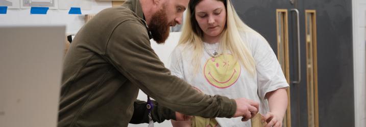 Student working with lecturer in the workshop