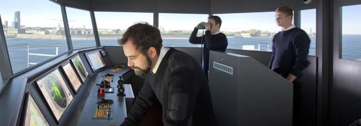 Nautical students in ships simulator.