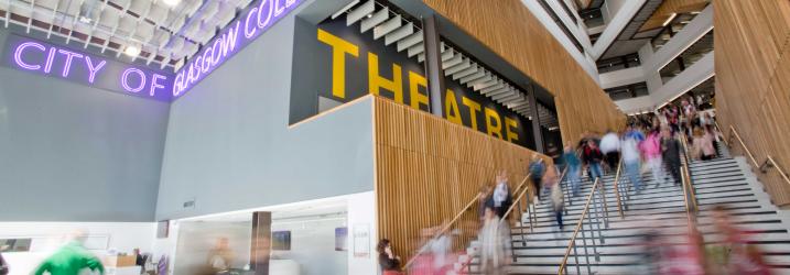 City campus entrance with students walking about showing the staircase.