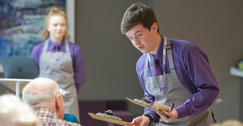 Students serving lunch in Scholars Training Restaurant.