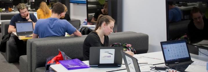 Students studying in breakout area at Riverside campus.