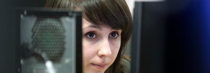 Girl using computer in class