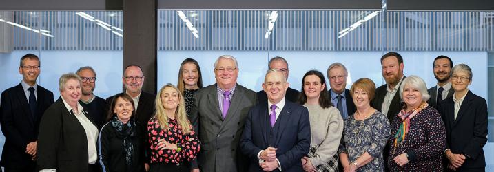 Group shot of the Board of Management standing in a line.