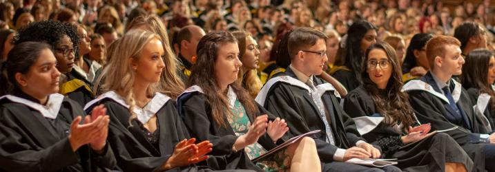 Graduates in the audience at a Graduation Ceremony.