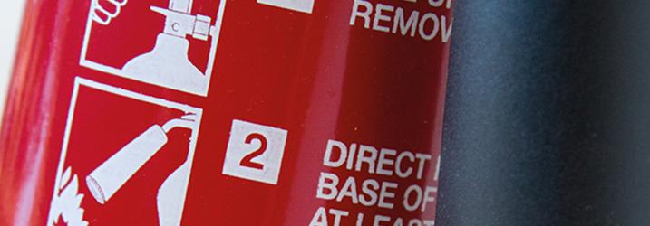 Close up of a fire extinguisher.