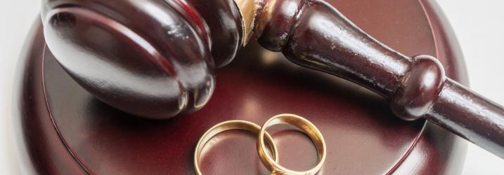 Marriage and Civil Partnership - hammer and gavel with two wedding rings.