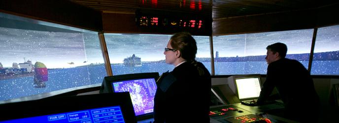 Students operating ships simulator