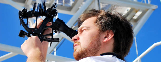 Nautical student using a sextant for celestial navigation.