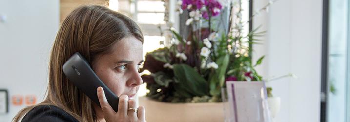 College reception staff taking a phone call