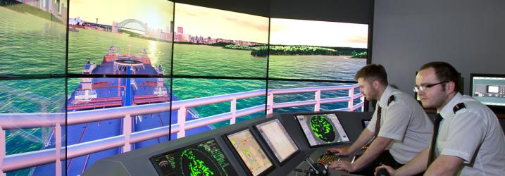 Students practicing on one of the shipping simulators at Riverside campus
