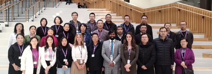 Group of overseas visitors in the atrium at City campus.