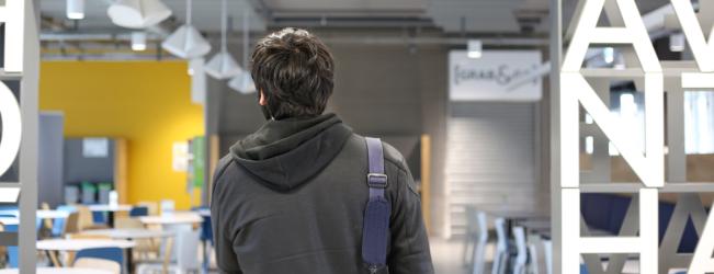 Student in canteen at City campus.