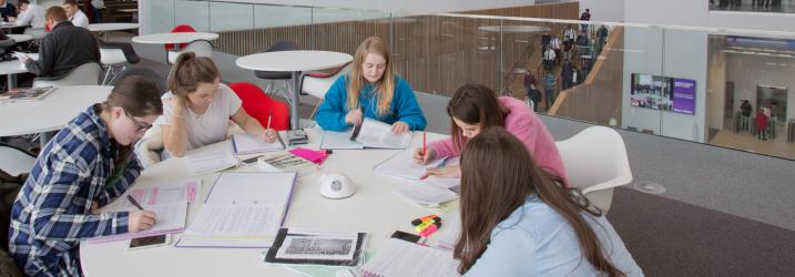 Students working at a breakout area at Riverside Campus