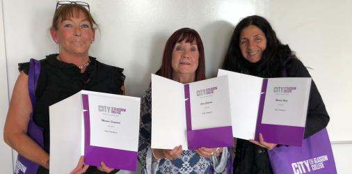 City Phonics students holding their certificates.