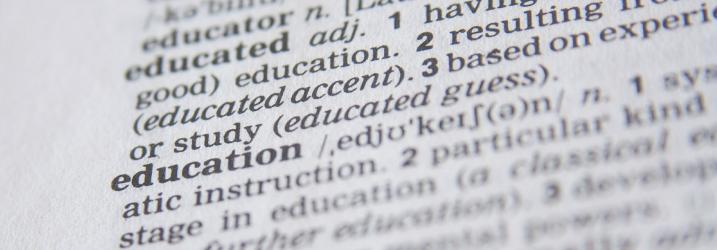 Close up of a page of text with the focus on the word education
